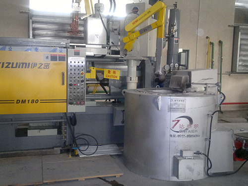 Crucible type melting and holding furnace